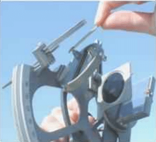 Adjusting top screw of horizon glass with socket wrench