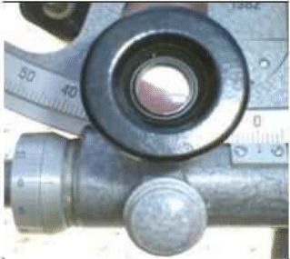 Reading the vernier scale with the magnifier